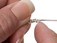 hands wrapping wire